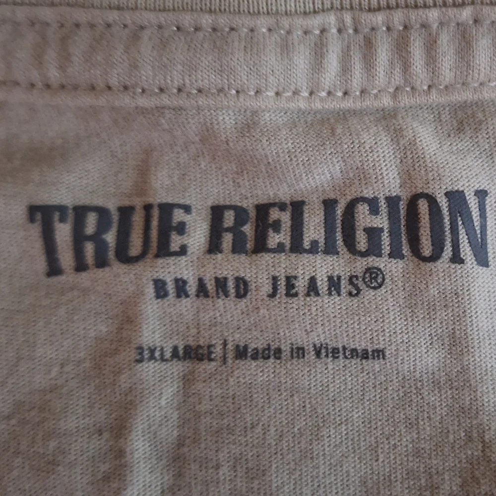 A True Religion T-shirt men's 3XL. Featuring the word True with Buddha